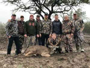Young hunter group with first kill