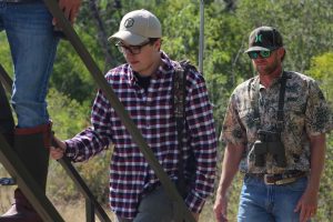 hunters going up stairs | Hooville Ranch hunting and lodging