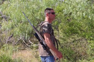 man with gun and mouth hanging open | Hooville Ranch hunting and lodging