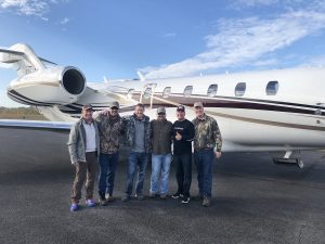 group of hunters being picked up at private jet | Hooville Ranch hunting and lodging