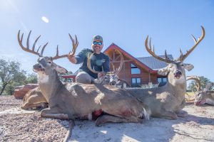 hunter with three buck kills | Hooville Ranch hunting and lodging