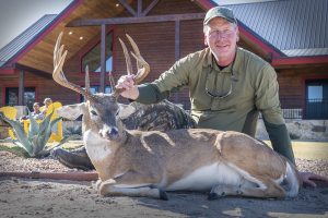 hunter holding deer antler | Hooville Ranch hunting and lodging