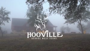 hooville logo over foggy lodge | Hooville Ranch hunting and lodging