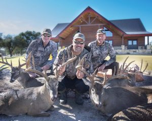 three hunters and their kills | Hooville Ranch hunting and lodging