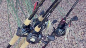 fishing poles resting near the pond | Hooville Ranch hunting and lodging
